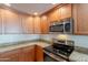 Stainless steel appliances and granite countertops in kitchen at 21320 N 56Th St # 2175, Phoenix, AZ 85054