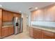 Kitchen with granite countertops and ample wood cabinetry at 21320 N 56Th St # 2175, Phoenix, AZ 85054