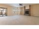 Spacious living room with stone fireplace and access to balcony at 21320 N 56Th St # 2175, Phoenix, AZ 85054