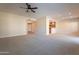 Open living room with kitchen and access to hallway at 21320 N 56Th St # 2175, Phoenix, AZ 85054
