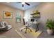 Home office with built-in shelving and window at 21320 N 56Th St # 2175, Phoenix, AZ 85054