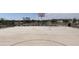 Outdoor basketball court with lines and goals, surrounded by a park-like setting at 24126 W Hidalgo Ave, Buckeye, AZ 85326