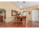 Dining area with hardwood floors and wooden table with chairs at 25820 S Beech Creek Dr, Sun Lakes, AZ 85248