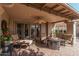 Relaxing covered patio with comfortable seating at 25820 S Beech Creek Dr, Sun Lakes, AZ 85248