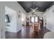 Bright dining room with hardwood floors, fireplace, and kitchen views at 2741 E Elmwood St, Mesa, AZ 85213