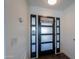 Modern entryway with a black door and frosted glass panels at 2741 E Elmwood St, Mesa, AZ 85213