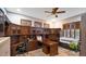 Bright home office featuring built-in cabinetry and wood desk at 29830 N 78Th Way, Scottsdale, AZ 85266