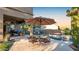 Inviting pool area with patio furniture and umbrella at 29830 N 78Th Way, Scottsdale, AZ 85266