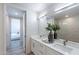 Modern bathroom with double vanity and a view into bedroom at 3131 N Central Ave # 6022, Phoenix, AZ 85012