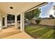 Covered patio overlooking a grassy backyard with a pool at 3370 S Pleasant Pl, Chandler, AZ 85248