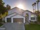 Two story home with a three-car garage and well maintained lawn at 3370 S Pleasant Pl, Chandler, AZ 85248