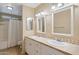 Bathroom with double vanity, tiled flooring and shower/tub at 3548 W Frier Dr, Phoenix, AZ 85051