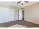 Spacious bedroom with double door closet and access to hallway at 3548 W Frier Dr, Phoenix, AZ 85051