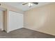 Bright bedroom with neutral carpeting and double door closet at 3548 W Frier Dr, Phoenix, AZ 85051