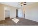 Bedroom with large closet, ceiling fan and access to bathroom at 3548 W Frier Dr, Phoenix, AZ 85051