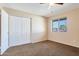 Bright bedroom with double door closet and window coverings at 3548 W Frier Dr, Phoenix, AZ 85051