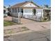 White house with a front porch, gate, and driveway at 393 N 20Th Dr, Phoenix, AZ 85009