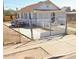 White house with a front porch and gated entrance at 393 N 20Th Dr, Phoenix, AZ 85009