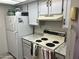 Well-equipped kitchen with stove, refrigerator and ample cabinetry at 540 N May St # 2109, Mesa, AZ 85201