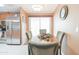 Dining area with table and chairs, adjacent to kitchen at 5735 E Mcdowell Rd # 457, Mesa, AZ 85215