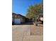 House exterior featuring a driveway, landscaping, and a garage at 5738 N 68Th Ave, Glendale, AZ 85303