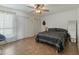 Bright bedroom with tiled floors, a ceiling fan, and a large closet at 6008 W Augusta Ave, Glendale, AZ 85301