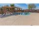 Community pool with pergola and plenty of space for relaxation at 6008 W Augusta Ave, Glendale, AZ 85301