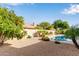 Relaxing backyard with a pool and citrus tree at 6442 E Winchcomb Dr, Scottsdale, AZ 85254