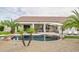 Inviting backyard with a sparkling pool, patio furniture, and lush landscaping at 730 E Mesquite St, Phoenix, AZ 85086