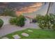Landscaped backyard with grass and stone pathways at 730 E Mesquite St, Phoenix, AZ 85086