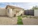 Landscaped backyard with a storage shed and gated entry at 730 E Mesquite St, Phoenix, AZ 85086