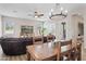 Open concept dining area with a rustic wooden table and seating at 730 E Mesquite St, Phoenix, AZ 85086