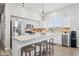 Modern kitchen with white cabinets and large island at 730 E Mesquite St, Phoenix, AZ 85086