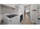 Laundry room with washer, dryer, and built-in shelving at 730 E Mesquite St, Phoenix, AZ 85086