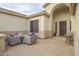 Covered patio with fire pit and seating area near entry at 730 E Mesquite St, Phoenix, AZ 85086