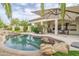 Stunning pool and patio with ample seating and a large umbrella at 730 E Mesquite St, Phoenix, AZ 85086