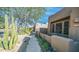 Landscaped front yard with walkway and cacti at 9573 E Chuckwagon Ln, Scottsdale, AZ 85262