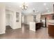 Kitchen with island, stainless steel appliances, and wood cabinets at 1026 W Dove Tree Ave, San Tan Valley, AZ 85140