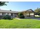 Single story home with carport and desert landscaping at 10927 W Peoria Ave, Sun City, AZ 85351