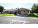 Ranch style home with carport and well-manicured lawn at 10927 W Peoria Ave, Sun City, AZ 85351