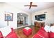 Living room with red sectional sofa and views to entryway and dining room at 11041 N 44Th St, Phoenix, AZ 85028