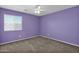 Bright bedroom with ceiling fan and neutral carpeting at 12783 W Lowden Rd, Peoria, AZ 85383