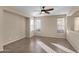 Bright living area with tile floors and ceiling fan at 12783 W Lowden Rd, Peoria, AZ 85383