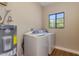 Convenient laundry room with washer, dryer, and extra storage at 1301 W Rio Salado Pkwy # 35, Mesa, AZ 85201