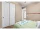 Bedroom with a bed and access to a hallway at 14859 W Surrey Dr, Surprise, AZ 85379