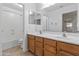 Clean bathroom with double sinks and a shower/tub combo at 17867 W Eugene Ter, Surprise, AZ 85388