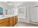 Elegant bathroom with double sinks, a bathtub, and a shower at 17867 W Eugene Ter, Surprise, AZ 85388