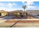 Front view of a one-story house with a two-car garage and desert landscaping at 17867 W Eugene Ter, Surprise, AZ 85388