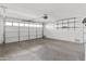 Attached garage with overhead door and storage shelves at 17867 W Eugene Ter, Surprise, AZ 85388