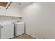 Laundry room with washer, dryer, and shelving at 17867 W Eugene Ter, Surprise, AZ 85388